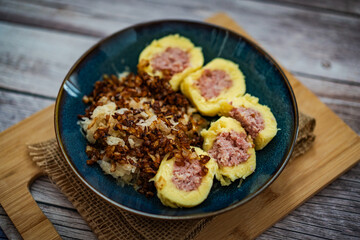 Traditional Czech Dish with Potato Dumplings, Smoked Meat, Sauerkraut, and Fried Onions