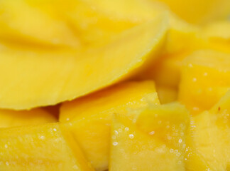 yellow fruit background. yellow natural food. peeled mango. mango with selective focus.