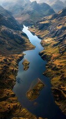 Fototapeta premium Aerial View of Highland Interplay: Rugged Terrain Meets Reflective Lake