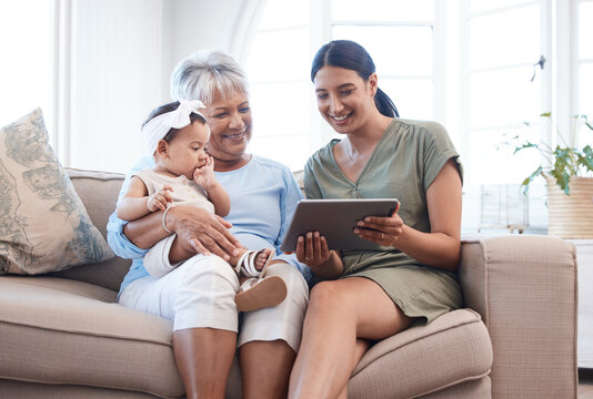 Granny, mother and baby on sofa, tablet and relax with happiness, bonding together and smile. Family, generations and mama with kid, technology and house with infant, online video and digital app - Powered by Adobe