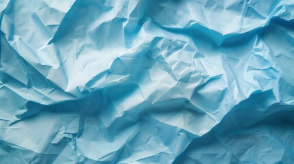 Obraz premium Close-up of wrinkled blue paper texture, ideal for scrapbooking and crafting. Top view