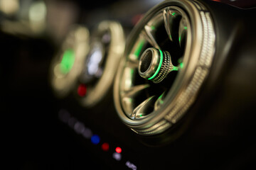 Closeup of car dashboard air vents near gear shift