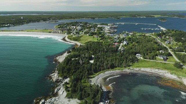 Aerial overview of the idyllic maritime village and harbour of Lockeport, Nova Scotia, Canada - home port to many a Lobsterman.  MAX QUAL PRORES422HQ Transcode of 4K H.265 D-CINELIKE original capture.