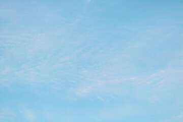 A beautiful sky tinted by the sun leaving vibrant shades of gold, pink, blue and multicolored. Clouds in the twilight evening and morning sky. Cloudy sky background in the evening, and during the day.