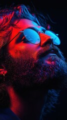 A man with a beard and sunglasses is looking at the camera. The image has a cool, futuristic vibe with a pop of color