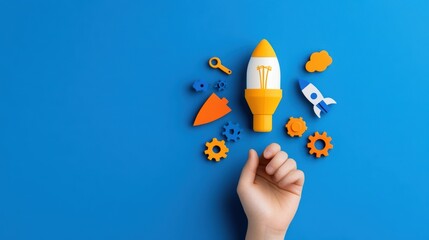 Child's hand reaching for rocket and gears on blue background. Concept of creativity, innovation, and startup.