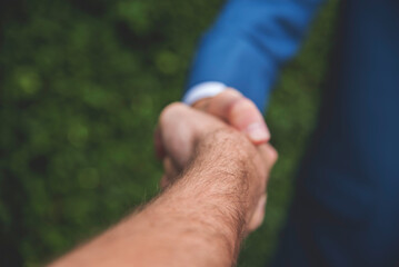 Trust honesty business customer handshake together promise respect partner. Businessman diversity solidarity team multiethnic Partner hands together teamwork. Multiracial meeting shaking hands concept