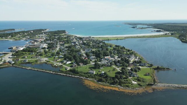 Aerial overview of the idyllic maritime village and harbour of Lockeport, Nova Scotia, Canada - home port to many a Lobsterman.  MAX QUAL PRORES422HQ Transcode of 4K H.265 D-CINELIKE original capture.