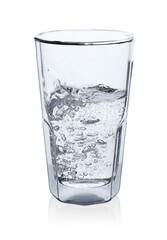 Pouring soda water from bottle into glass on white background