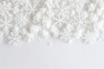 winter themed image featuring white snowflakes and artificial snow, creating serene and festive atmosphere. Perfect for holiday designs