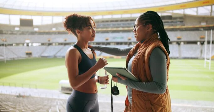 Women, runner and sport with coach at stadium for motivation, training schedule or workout routine. Female people, athlete and personal trainer talking with sprinter for exercise or fitness practice