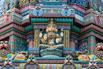 Colored decorations and statues on the exterior of the Hindu Temple Sri Maha Mariamman Temple ("Wat Phra Si Maha Umathewi") on Si Lom Road in Bangkok, Thailand. Built in1879.
