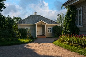 A nanny's house on the territory of the Mikhailovskoye estate of the Pushkin Museum-Reserve on a sunny summer day, Pushkinskiye Gory, Pskov region, Russia