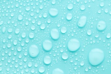 Water drops on turquoise background, top view