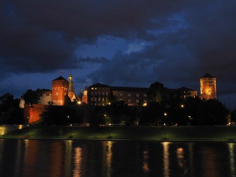 night view of Wawel Castle of Cracow Poland, seen from Vistula river 