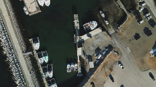 Commercial lobster fishing vessels abound in this aerial view of picturesque Lockeport harbour, Lockeport, Nova Scotia, Canada.  MAX QUAL PRORES422HQ Transcode of 4K H.265 D-CINELIKE original capture.