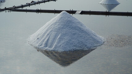 a salt farm with a pile of salt