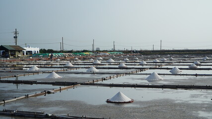 a salt farm with a pile of salt