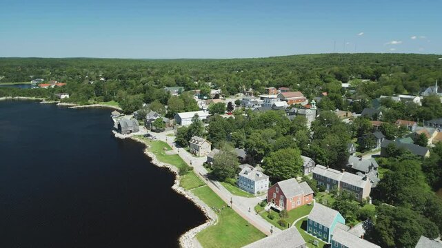 Aerial view of Atlantic Canada's historic Shelburne harbour waterfront, buildings and shoreline park, Nova Scotia, Canada. MAX QUAL PRORES422HQ Transcode of 4K H.265 D-CINELIKE original capture.