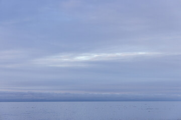 Tranquil Seascape With Cloudy Sky Over Calm Ocean Waters