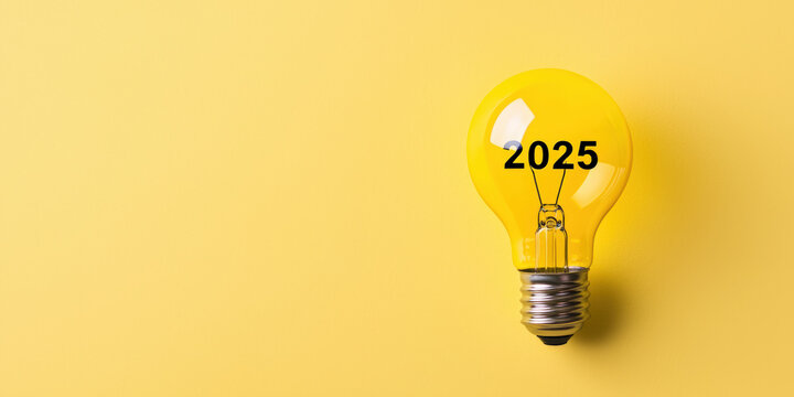 A bright yellow light bulb with "2025" printed on it, symbolizing innovation and ideas for the future.
