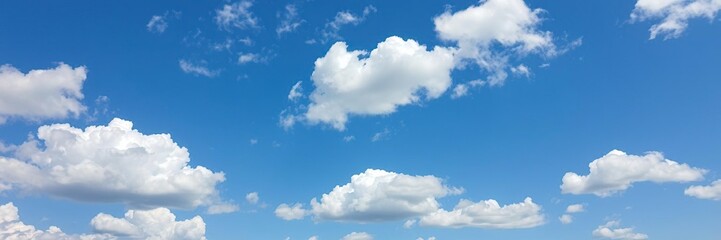 Obraz premium A stunning blue sky with cumulus clouds in various shapes and sizes floating gently, atmosphere, nature