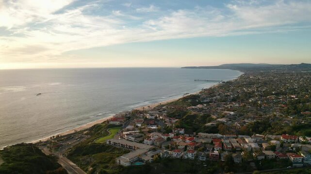 Aerial drone exploration of San Clemente California's coastline at sunset