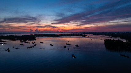 Dawn awakens and calms the fishing village in the lagoons of Hue.