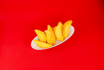 Colombian empanada with spicy sauce 