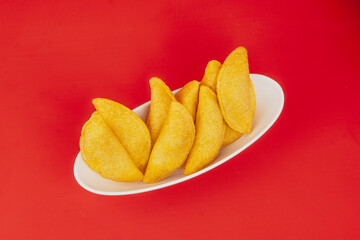 Delicious traditional Colombian empanadas with spicy sauce