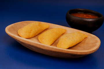 Delicious traditional Colombian empanadas with spicy sauce
