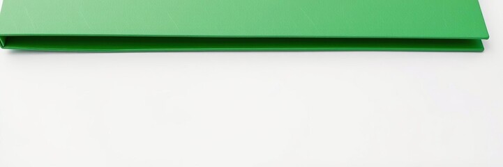 Obraz premium Close-up of green folder on white background with grey edges, white background, file holder, gray folder