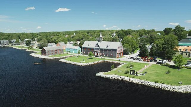 Aerial view of historic Shelburne harbour's Fishing Industry Tribute Memorial Park and Museums by The Sea, Nova Scotia, Canada.  MAX QUAL PRORES422HQ Transcode of 4K H.265 D-CINELIKE original capture.