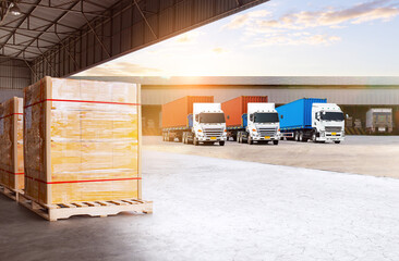 Semi Trailer Trucks on The Parking Lot at Warehouse Port. Bulk of Package Boxes Wrapped Plastic Stacked on Pallets. Distribution Warehouse. Cargo Container Shipping. Freight Truck Logistics Transport.