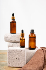 Amber Glass Bottles on Textured Stone Blocks with Minimalist Style