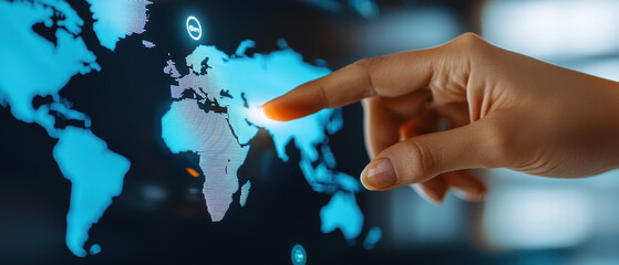 A hand points at a digital world map, focusing on Europe and nearby regions, highlighting global interactivity and connectivity.