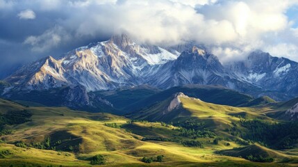 Majestic mountain landscape with clouds and green hills.