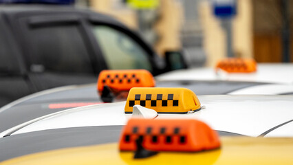 Moscow, Russia, November 08, 2024: taxi cars with checkers on the street of Moscow