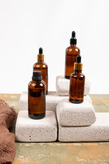 Amber Glass Bottles on Textured Stone Blocks with Minimalist Style