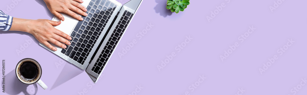 Sticker person using a laptop computer from above