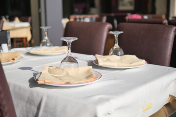Elegant Restaurant Table Setting Featuring Beautiful Glassware and Folded Napkins for Guests