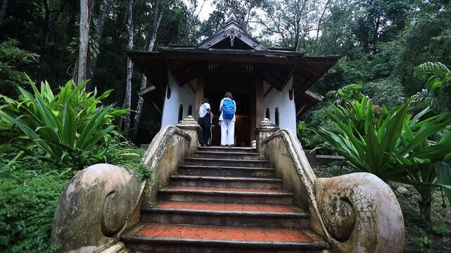 Nature video background of the atmosphere inside the religious tourist attraction in the middle of nature Meditation Point of Pha Lat Fall, the way up to Doi Suthep, Chiang Mai, travelers always stop 