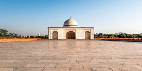 Fototapeta premium A serene morning view of the Taj Mahal, showcasing its iconic architecture and surrounding grounds