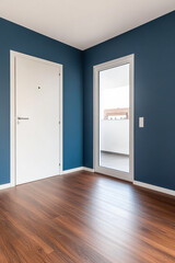Modern interior of a bright room with blue walls and wooden flooring, featuring a balcony door