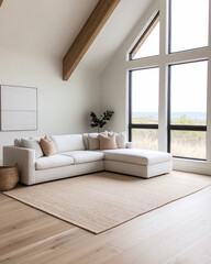 Modern living room with a cozy white couch overlooking a scenic landscape and large windows