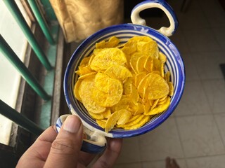 A bowl of tasty banana chips © JN