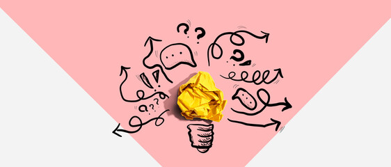 Brainstorming concept with a crumpled paper light bulb - Flat lay © Tierney