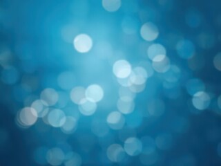 Abstract blue background with soft, out-of-focus bokeh lights creating a dreamy and serene atmosphere, patterns, background