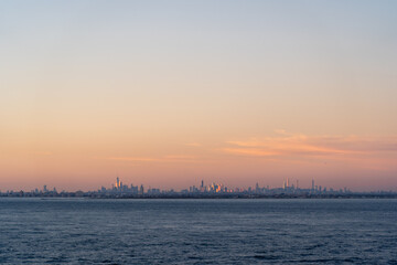 Stunning New York City skyline at sunset with vibrant colors and iconic buildings