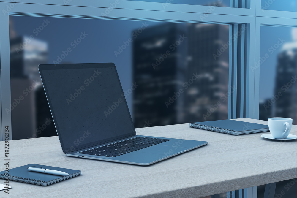 Poster Perspective view on blank dark laptop screen with copyspace for your logo or text on light wooden table with notebooks and coffee cup on night city view from window background. 3D rendering, mock up